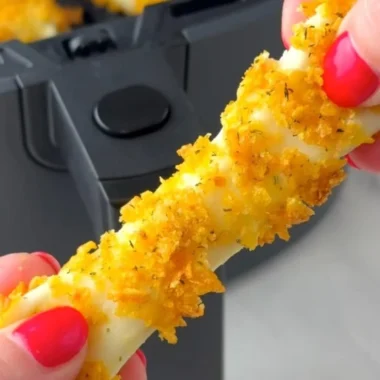 Delicious Air Fryer Mozzarella Sticks served with marinara sauce