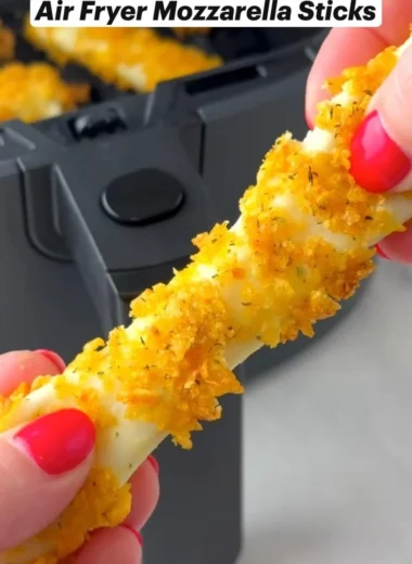 Delicious Air Fryer Mozzarella Sticks served with marinara sauce