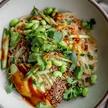 Cold sesame miso noodles served in a bowl with fresh veggies
