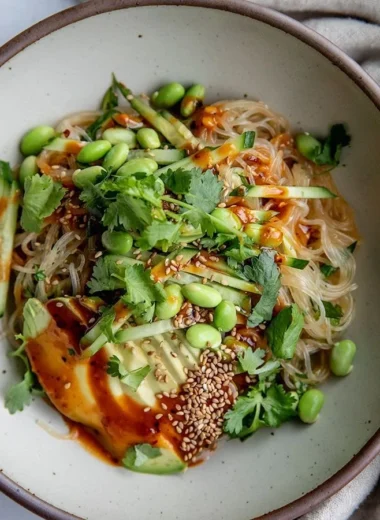 Cold sesame miso noodles served in a bowl with fresh veggies