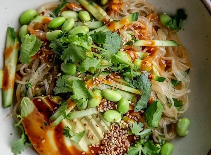 Cold sesame miso noodles served in a bowl with fresh veggies