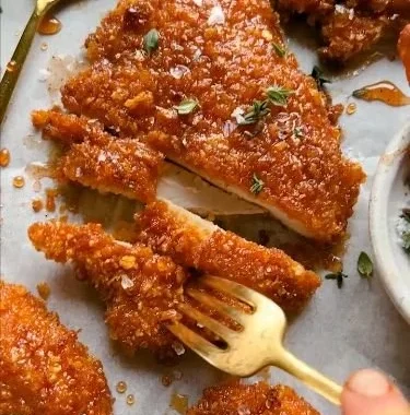Cornflake-Crusted Chicken served on a plate with dipping sauce
