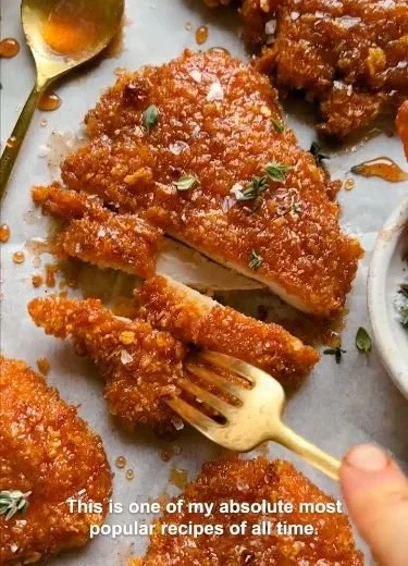 Cornflake-Crusted Chicken served on a plate with dipping sauce
