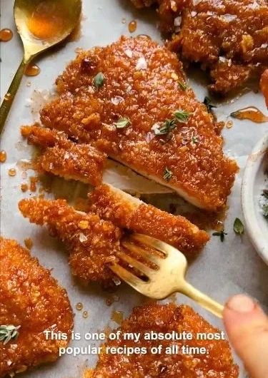 Cornflake-Crusted Chicken served on a plate with dipping sauce