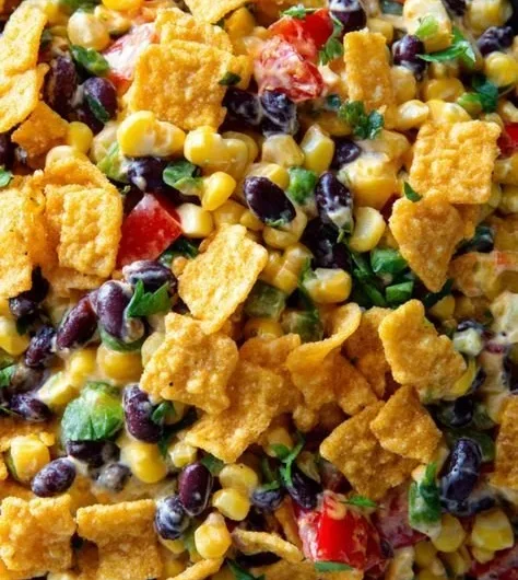 Creamy Frito Corn Salad in a colorful bowl with fresh ingredients