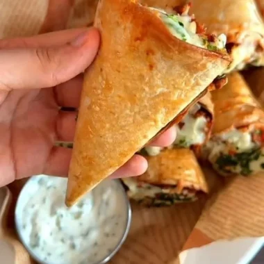 Tortilla cones filled with mixed toppings on a plate