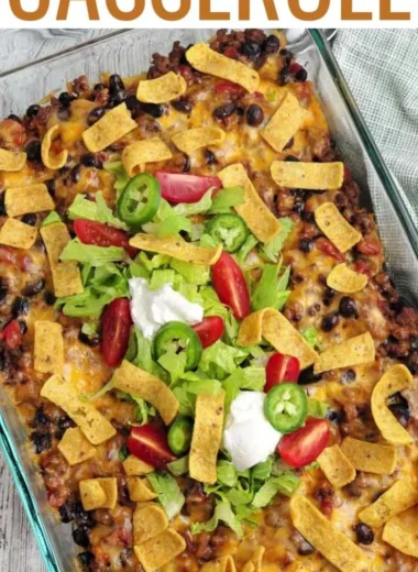 Delicious walking taco casserole served in a bowl with toppings.