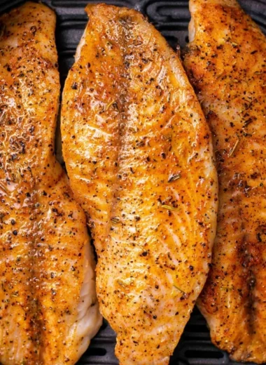 Delicious air-fried tilapia fillets garnished and ready to serve