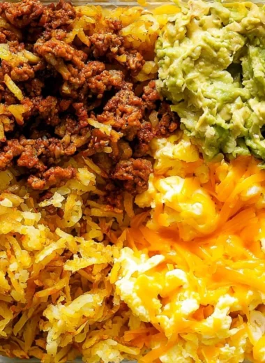 Healthy breakfast burrito bowl with eggs, veggies, and avocado