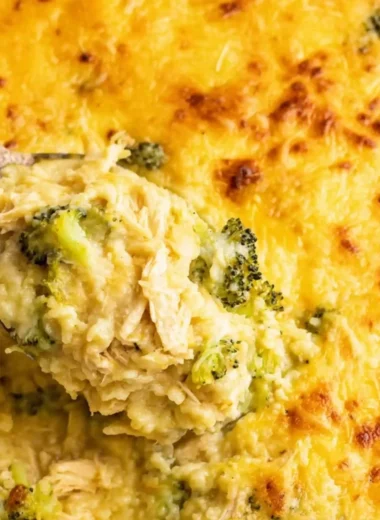 Broccoli, rice, cheese, and chicken casserole dish piping hot from the oven