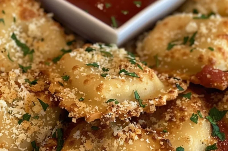 Crispy air fryer ravioli served on a plate with dipping sauce