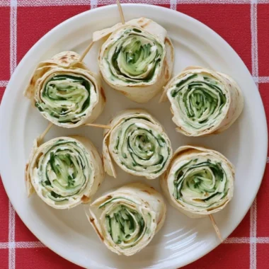Delicious cucumber wrap sandwiches displayed on a platter.