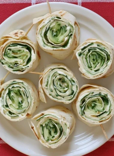 Delicious cucumber wrap sandwiches displayed on a platter.