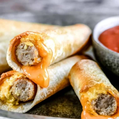 Easy breakfast taquitos filled with eggs and cheese on a plate