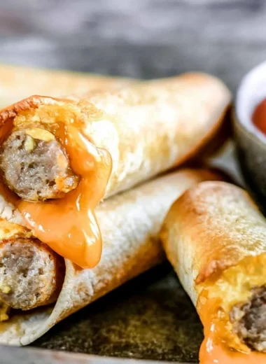 Easy breakfast taquitos filled with eggs and cheese on a plate
