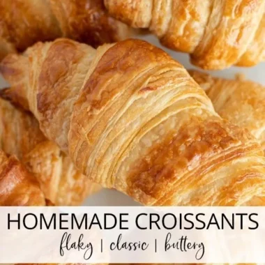Freshly baked homemade classic croissants on a wooden board