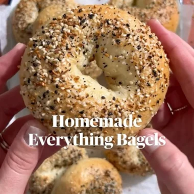 Homemade everything bagels fresh out of the oven, sprinkled with seasoning.