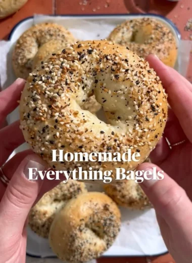 Homemade everything bagels fresh out of the oven, sprinkled with seasoning.