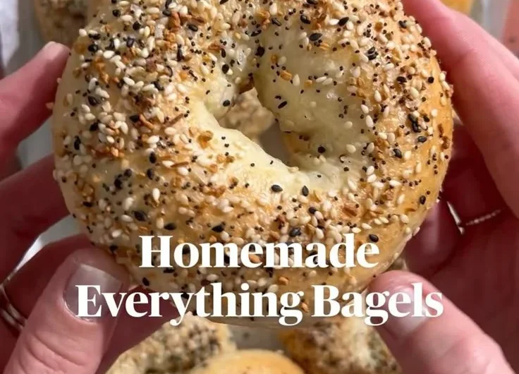 Homemade everything bagels fresh out of the oven, sprinkled with seasoning.