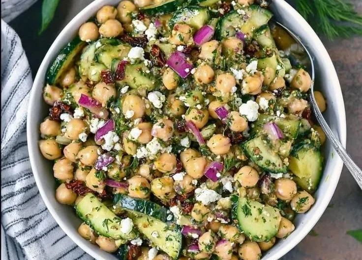 Healthy Mediterranean Chickpea Salad with fresh vegetables and dressing