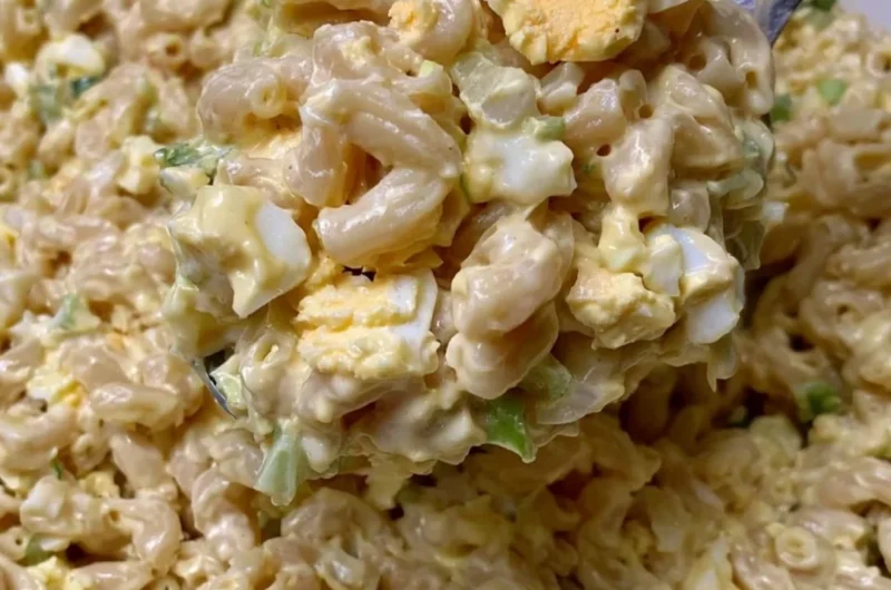Homemade Mom's macaroni salad in a bowl with fresh vegetables