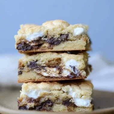 Delicious Mud Hen Bars served on a plate, showcasing their rich and gooey texture.
