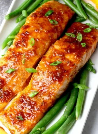 Delicious Peach Glazed Salmon served with a fresh garnish