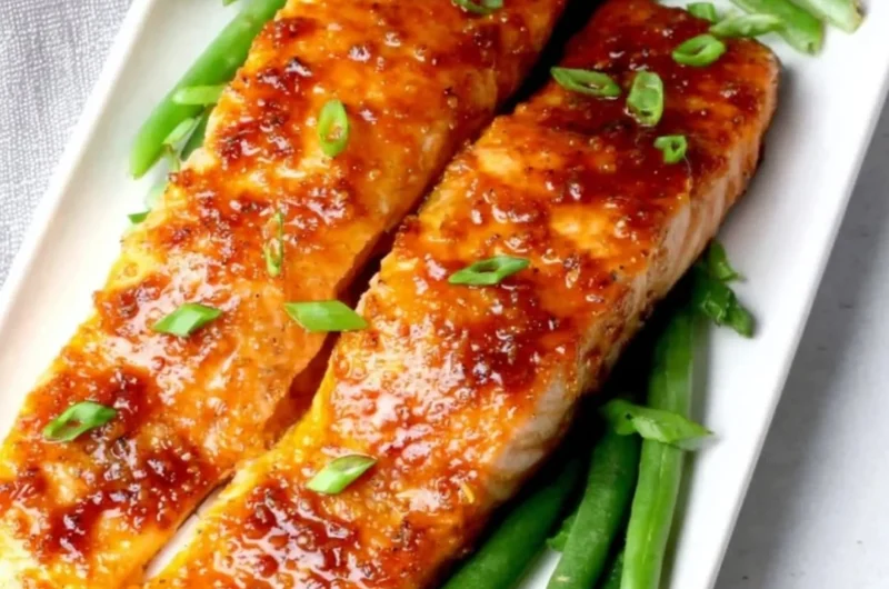 Delicious Peach Glazed Salmon served with a fresh garnish