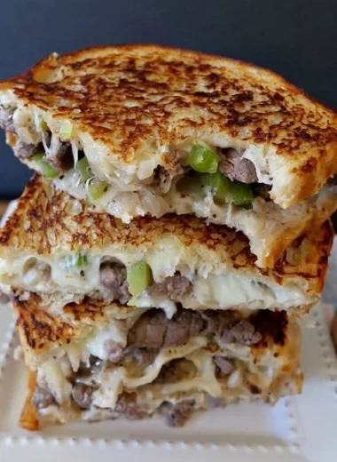 Delicious Philly Cheesesteak Grilled Cheese sandwich on a plate.