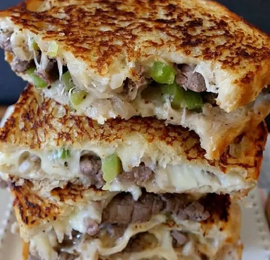 Delicious Philly Cheesesteak Grilled Cheese sandwich on a plate.