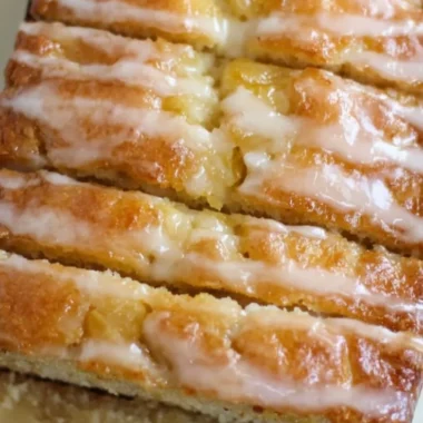 Delicious slice of homemade pineapple bread with fresh pineapple chunks
