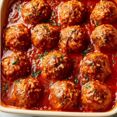 Plate of homemade Porcupine Meatballs with rice and tomato sauce
