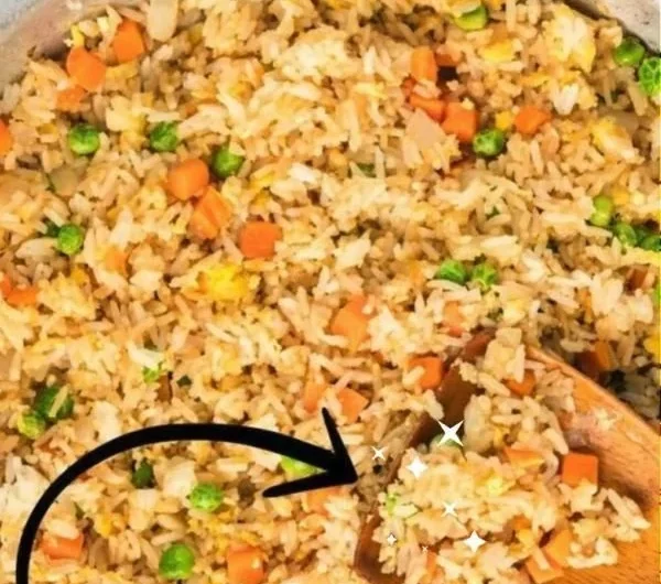 Delicious plate of quick and easy homemade fried rice with vegetables and protein