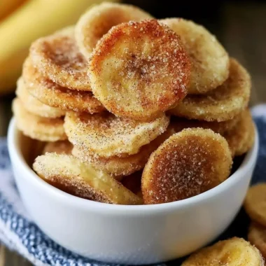 Crispy cinnamon-sugar air fryer banana chips in a bowl for a delicious snack