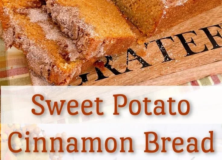 Loaf of homemade sweet potato bread on a wooden cutting board