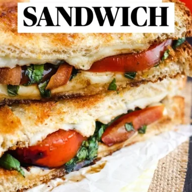 Toasted Caprese sandwich with mozzarella, basil, and tomatoes on crusty bread