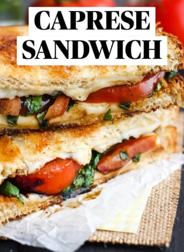 Toasted Caprese sandwich with mozzarella, basil, and tomatoes on crusty bread