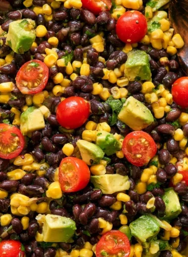 Vegan black bean salad with fresh vegetables and herbs
