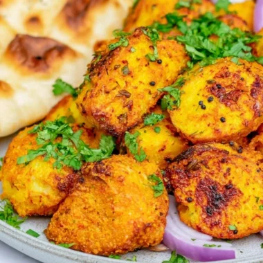 Delicious Bombay Potatoes served in a traditional Indian dish.