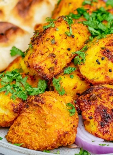 Delicious Bombay Potatoes served in a traditional Indian dish.