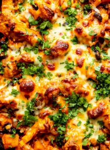 Butternut squash enchilada skillet with black beans and cheese topped