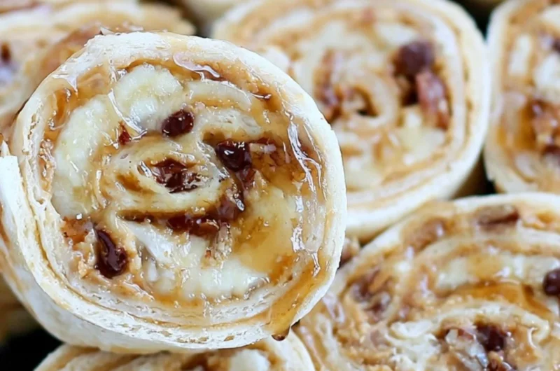 Chocolate chip banana roll ups with peanut butter on a plate