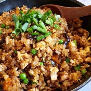 Delicious bowl of Cozy Chinese Egg Fried Rice topped with green onions.