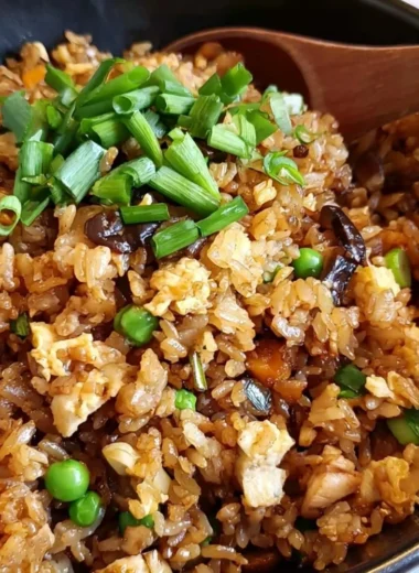 Delicious bowl of Cozy Chinese Egg Fried Rice topped with green onions.