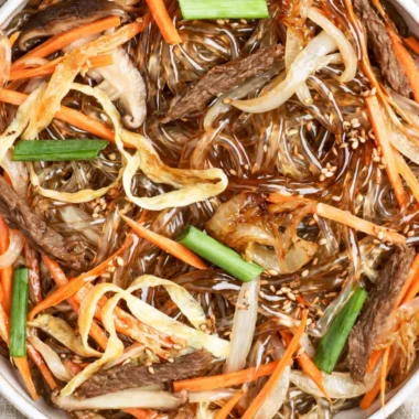 Cozy Japchae - Delicious Korean stir-fried noodles with vegetables and beef