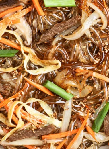 Cozy Japchae - Delicious Korean stir-fried noodles with vegetables and beef