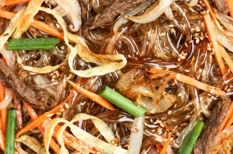 Cozy Japchae - Delicious Korean stir-fried noodles with vegetables and beef