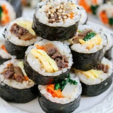 Delicious homemade Kimbap rolls filled with fresh ingredients, perfect for any meal.