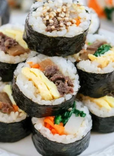 Delicious homemade Kimbap rolls filled with fresh ingredients, perfect for any meal.