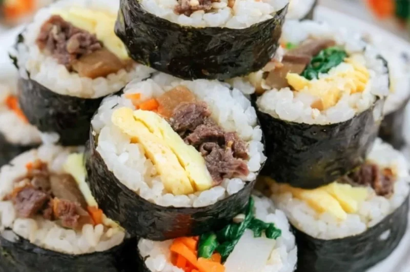 Delicious homemade Kimbap rolls filled with fresh ingredients, perfect for any meal.
